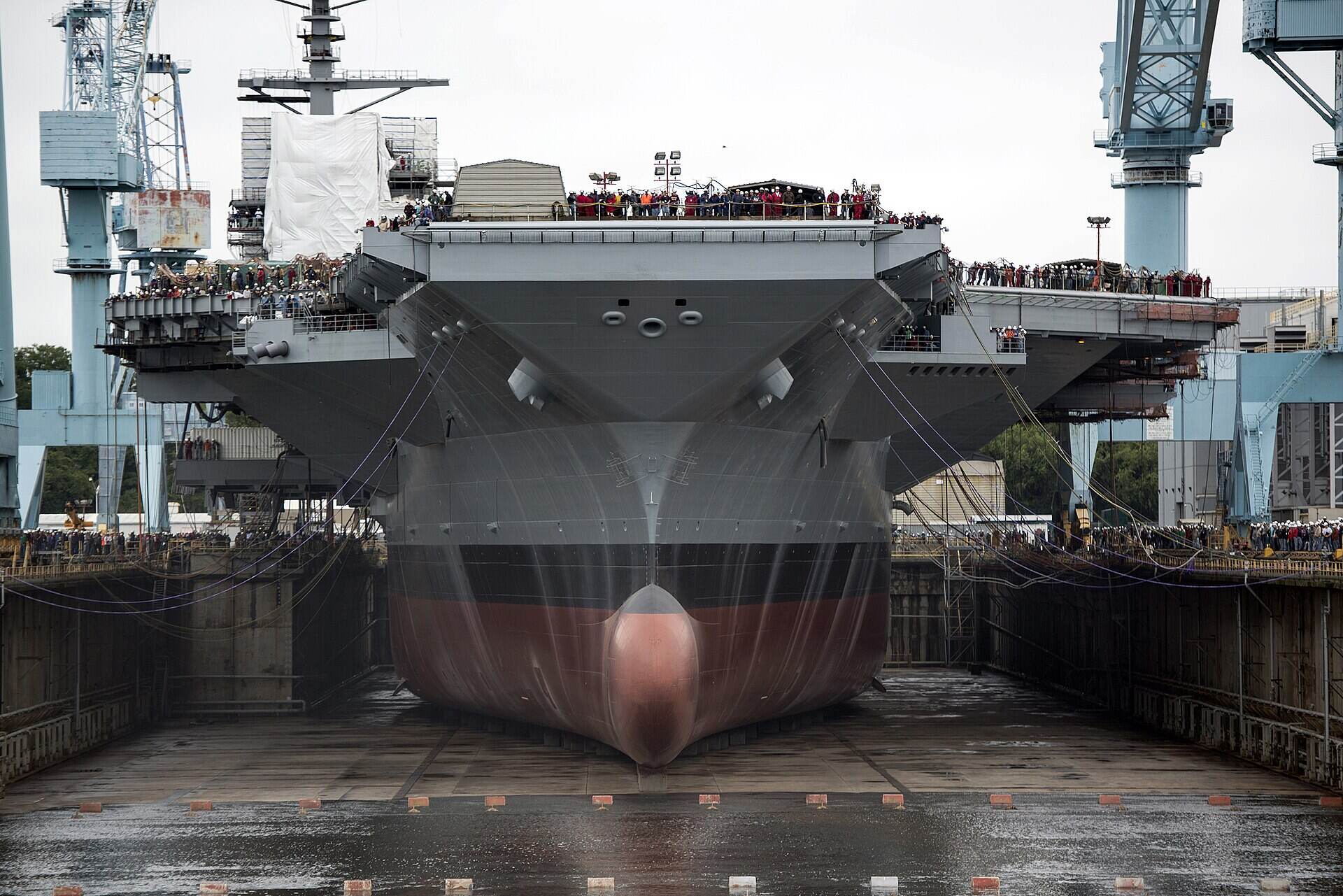 U.S. Navy aircraft carrier in dry dock at a Hampton Roads shipyard