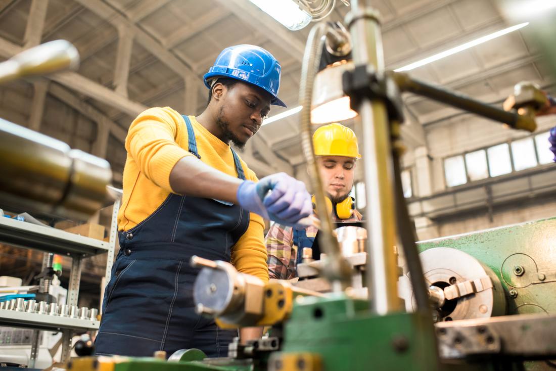 Machinists working together in a shop